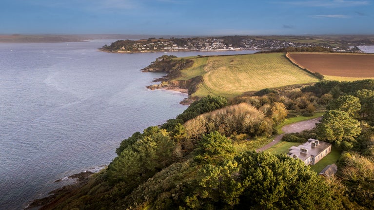 An aerial view of the holiday cottages at St Anthony Head, overlooking the estuary, Cornwall